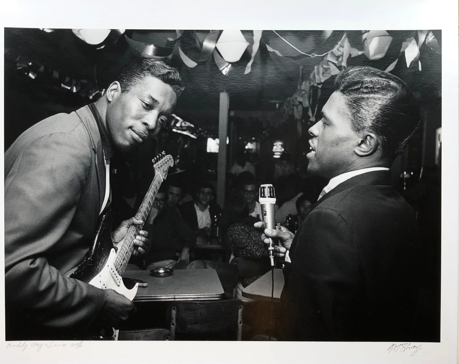 Buddy Guy and Junior Wells performing together in a Chicago Blues club, photographed by Art Shay