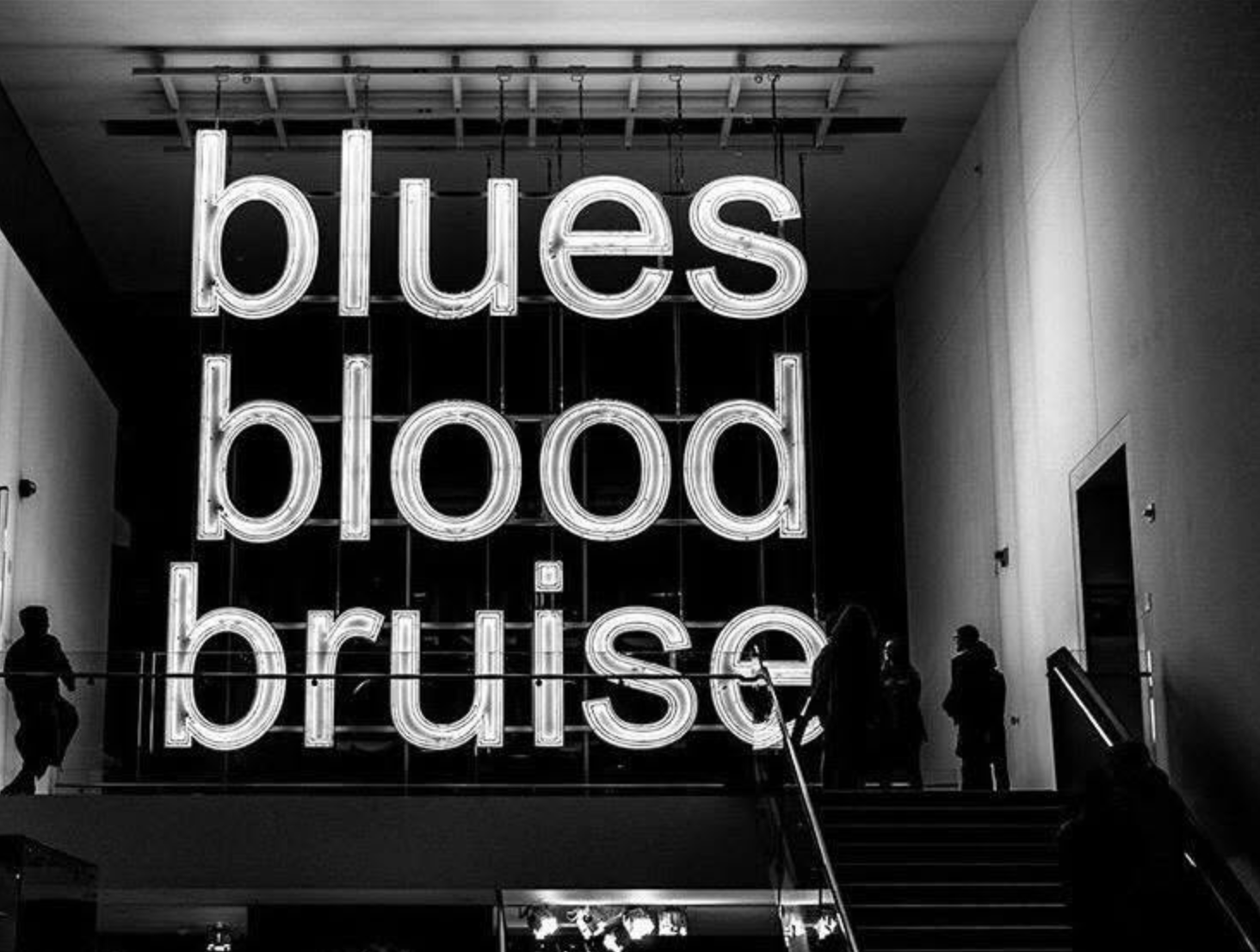 Glenn Ligon’s illuminated installation A Small Band reading blues, blood, bruise