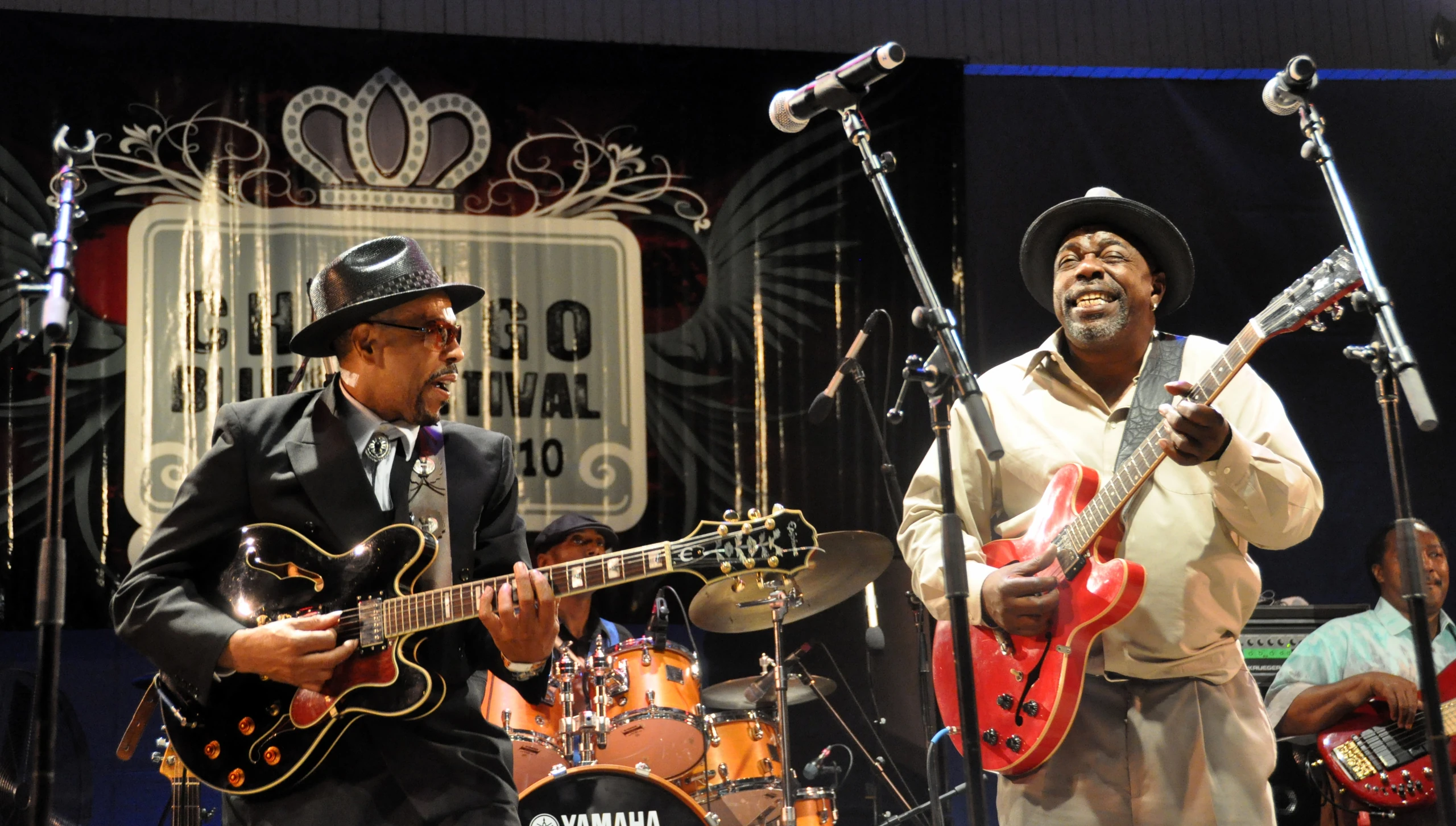 Blues artists performing together onstage